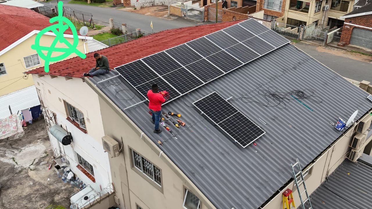 Amostron team working safely on residential rooftop solar installation