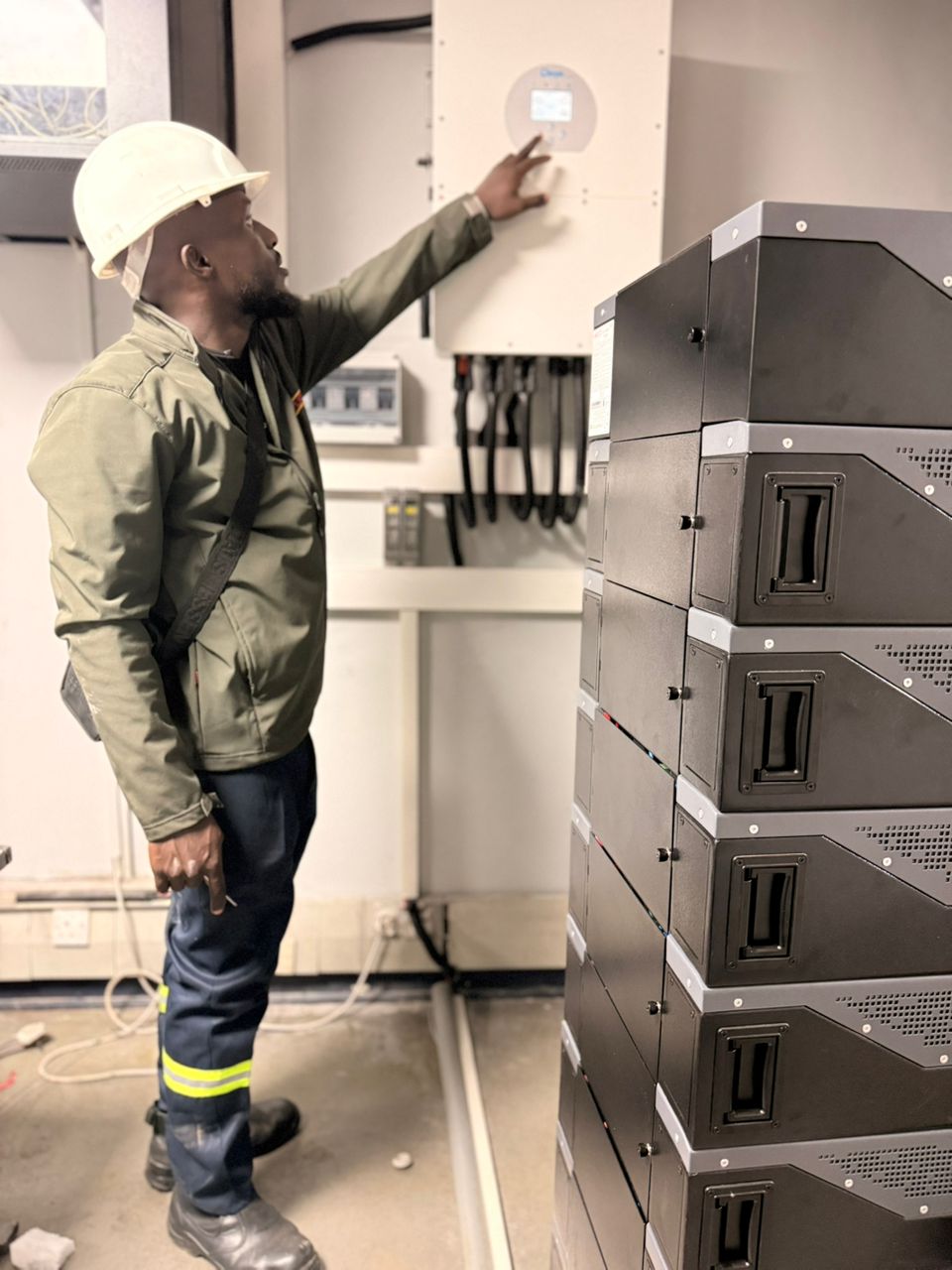 Amostron engineer in PPE commissioning large-scale battery storage system